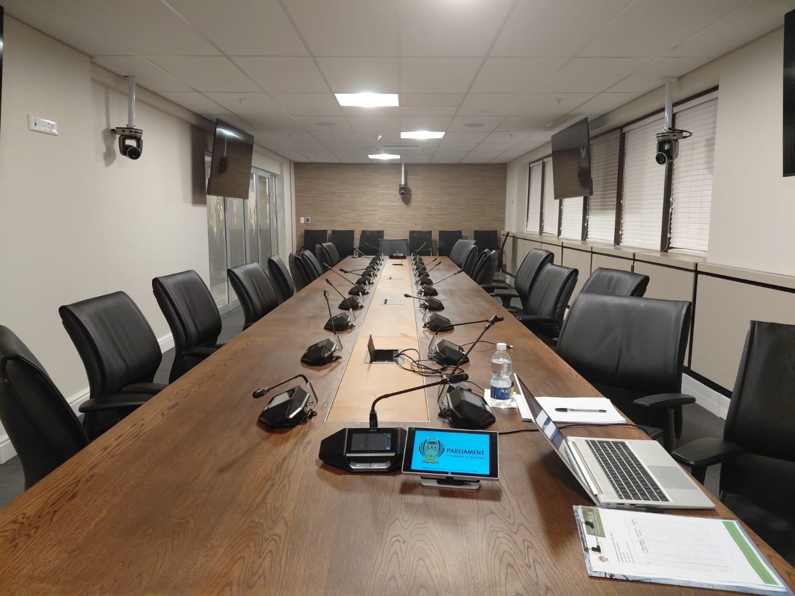 A professional boardroom prepared for a workplace wellbeing conversation