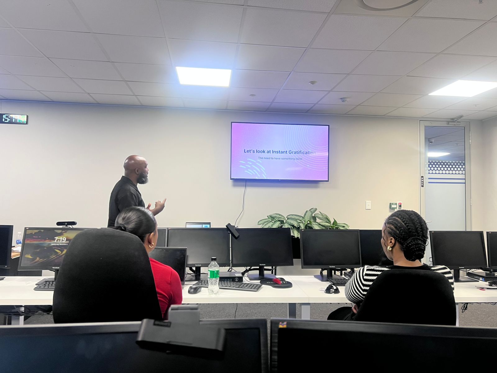 A workplace wellbeing facilitation session in a boardroom setting